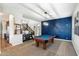 Spacious game room featuring a pool table and stylish blue accent wall at 1180 E Ibis St, Gilbert, AZ 85297