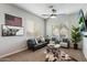 Cozy living room with neutral tones and ample natural light from the window at 1180 E Ibis St, Gilbert, AZ 85297