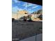 The backyard has a stone patio area, mature landscaping, and a block fence at 12510 W Wells St, El Mirage, AZ 85335