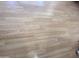 Close-up of laminate flooring, highlighting its wood-like appearance and durable design at 1281 S Sioux Dr, Apache Junction, AZ 85119