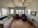 Cozy living room offers generous natural light, ceiling fan, and comfortable seating, perfect for relaxation at 1281 S Sioux Dr, Apache Junction, AZ 85119