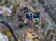 Expansive aerial view of a luxurious estate featuring a pool, solar panels, and desert landscaping at 13808 S Canyon Dr, Phoenix, AZ 85048