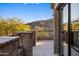 Spacious balcony with stone railing provides stunning mountain views and seamless indoor-outdoor flow at 13808 S Canyon Dr, Phoenix, AZ 85048