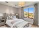 Bright bedroom with plush bedding, scenic views from the window at 13808 S Canyon Dr, Phoenix, AZ 85048