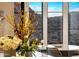 Close up of breakfast nook with valley views, marble table and modern woven chairs at 13808 S Canyon Dr, Phoenix, AZ 85048