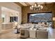 Open-concept living room with stone accent walls, wood beam ceilings, and mountain views at 13808 S Canyon Dr, Phoenix, AZ 85048