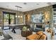 Comfortable living room with stone walls, a stylish sofa, and an air hockey game table at 13808 S Canyon Dr, Phoenix, AZ 85048