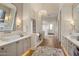 Luxurious main bathroom with dual vanities, a soaking tub, and modern fixtures at 13808 S Canyon Dr, Phoenix, AZ 85048