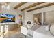 Elegant main bedroom featuring beamed ceilings, a fireplace, and access to the bathroom and hallway at 13808 S Canyon Dr, Phoenix, AZ 85048