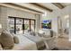 Bright main bedroom with a view of the outdoor living space and a large window for natural light at 13808 S Canyon Dr, Phoenix, AZ 85048