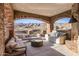 Covered outdoor patio with stunning mountain views and ample seating at 13808 S Canyon Dr, Phoenix, AZ 85048