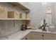 Pantry with open shelves, white tile walls, and counter top at 13808 S Canyon Dr, Phoenix, AZ 85048