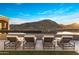 Stunning infinity pool and sun loungers offer breathtaking desert landscape views at 13808 S Canyon Dr, Phoenix, AZ 85048