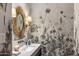 Chic powder room featuring unique floral wallpaper and modern fixtures at 13808 S Canyon Dr, Phoenix, AZ 85048