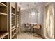 Cozy wine cellar with a small table, seating for two, and custom wine storage at 13808 S Canyon Dr, Phoenix, AZ 85048