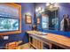 Unique bathroom featuring a rustic wood vanity, vessel sink, and southwestern accents at 14215 E Calle De Las Estrellas Dr, Scottsdale, AZ 85262