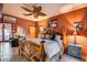 Rustic bedroom featuring a handcrafted wooden bed frame and warm, inviting decor at 14215 E Calle De Las Estrellas Dr, Scottsdale, AZ 85262