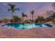 Gorgeous in-ground pool with a rock waterfall feature and desert landscaping, perfect for outdoor relaxation and entertainment at 14215 E Calle De Las Estrellas Dr, Scottsdale, AZ 85262