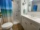 Bathroom featuring a vanity with a white countertop and mirror, adjacent to a shower at 1506 S Omaha Dr, Apache Junction, AZ 85119