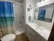 Bathroom featuring a vanity with a white countertop and mirror, adjacent to a shower at 1506 S Omaha Dr, Apache Junction, AZ 85119