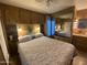 Comfortable bedroom with a bed and built-in storage cabinets at 1506 S Omaha Dr, Apache Junction, AZ 85119