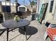 Outdoor patio area with an outdoor kitchen, shed, and gray tile pavers, perfect for entertaining at 1506 S Omaha Dr, Apache Junction, AZ 85119