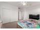 Bedroom with a ceiling fan and a large closet at 16789 W Moreland St, Goodyear, AZ 85338