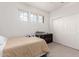 Bedroom with a double closet and three windows at 16789 W Moreland St, Goodyear, AZ 85338