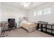 Bedroom with two windows, ceiling fan, desk, and bed at 16789 W Moreland St, Goodyear, AZ 85338