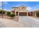 Charming two-story home featuring a desert landscape, brown garage door and a classic design at 16789 W Moreland St, Goodyear, AZ 85338