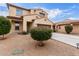 Charming two-story home featuring a desert landscape, brown garage door and a classic design at 16789 W Moreland St, Goodyear, AZ 85338