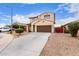 Charming two-story home featuring a desert landscape, brown garage door and a classic design at 16789 W Moreland St, Goodyear, AZ 85338