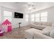 Cozy living room features neutral walls, tile flooring, recessed lighting and a sofa at 16789 W Moreland St, Goodyear, AZ 85338