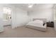 Cozy main bedroom features a ceiling fan, neutral decor, and an en-suite bathroom at 16789 W Moreland St, Goodyear, AZ 85338