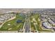 Aerial view of a community featuring a golf course, pools, and homes at 17205 W Middlebury St, Surprise, AZ 85388