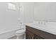 Bright bathroom featuring a shower-tub combo, toilet, and large vanity with sleek fixtures at 17205 W Middlebury St, Surprise, AZ 85388