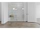 Modern bathroom featuring a glass-enclosed shower with marble tile and a built-in bench at 17205 W Middlebury St, Surprise, AZ 85388