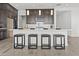 Beautiful kitchen island featuring pendant lighting, a white countertop, and ample seating at 17205 W Middlebury St, Surprise, AZ 85388