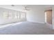 Inviting bedroom featuring soft carpet, neutral walls, and a ceiling fan offers a serene retreat at 18430 E Ashridge Dr, Queen Creek, AZ 85142