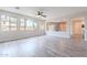 Bright and airy living room featuring a wall of windows and hardwood floors at 18430 E Ashridge Dr, Queen Creek, AZ 85142