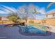 Backyard pool featuring a unique rock waterfall feature at 18430 E Ashridge Dr, Queen Creek, AZ 85142