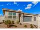 Home featuring low maintenance desert landscaping in front yard and a neutral colored exterior at 18434 W Chama Dr, Surprise, AZ 85387