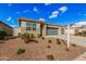 Home featuring low maintenance desert landscaping in front yard and a neutral colored exterior at 18434 W Chama Dr, Surprise, AZ 85387