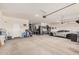 Spacious garage featuring a Corvette and plenty of storage at 18434 W Chama Dr, Surprise, AZ 85387