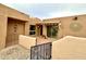 Charming courtyard with desert landscaping, privacy walls, and a tiled patio at 18753 E Chinle Dr, Rio Verde, AZ 85263