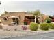 View of a desert home with tile roof, covered patio and landscaping at 18753 E Chinle Dr, Rio Verde, AZ 85263