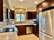 Well-lit kitchen with stainless steel appliances, tile backsplash, and plenty of counter space at 18753 E Chinle Dr, Rio Verde, AZ 85263