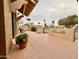 Spacious tiled patio with desert wall art, BBQ, and seating area at 18753 E Chinle Dr, Rio Verde, AZ 85263