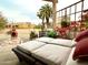 A beautiful outdoor patio with a daybed and desert landscaping at 18753 E Chinle Dr, Rio Verde, AZ 85263