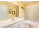 Bathroom features a white vanity, ample counter space, and shower with sliding doors at 19093 N 97Th Ln, Peoria, AZ 85382